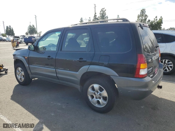 2001 Mazda Tribute LX with VIN 4F2YU09151KM38909, listed as a Copart auction lot 77808264 with 136,005 mi miles and Salvage Title. Bid and sale history available at carsss.com. Image 2.