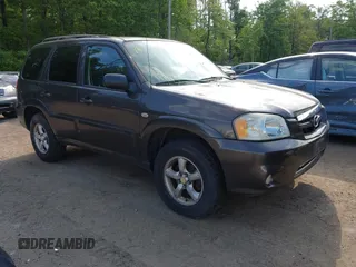 2006 Mazda Tribute LX with VIN 4F2YZ94136KM23037, listed as a IAAI auction lot 42220090 with 144,039 mi miles. Bid and sale history available at carsss.com. Image 1.