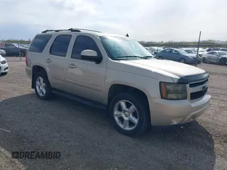 2007 Chevrolet Tahoe LTZ z VIN 1GNFK13087J222075, wystawiony jako IAAI lot #42032419 z przebiegiem 150 698 mil mil oraz . Historia ofert i sprzedaży dostępna na DreamBid. Obrazek 1.