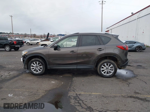 2016 Mazda CX-5 Touring with VIN JM3KE4CY5G0695242, listed as a IAAI auction lot 41795135 with 195,162 mi miles. Bid and sale history available at carsss.com. Image 13.