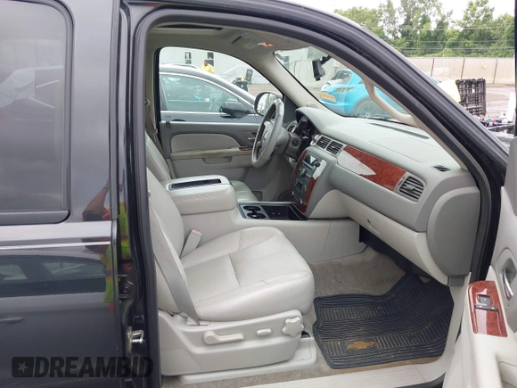 2011 Chevrolet Suburban with VIN 1GNWKMEG1BR374950, listed as a IAAI auction lot 42781182 with 304,690 mi miles and . Bid and sale history available at DreamBid. Image 5.