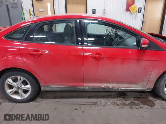 2013 Ford Focus SE z VIN 1FADP3F20DL352710, wystawiony jako IAAI lot #41549408 z przebiegiem 97 460 mil mil oraz . Historia ofert i sprzedaży dostępna na DreamBid. Obrazek 14.