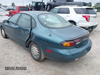 1996 Ford Taurus LX with VIN 1FALP53S3TG177324, listed as a IAAI auction lot 42622520 with 126,979 mi miles and . Bid and sale history available at DreamBid. Image 3.