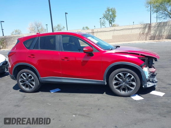 2016 Mazda CX-5 Grand Touring z VIN JM3KE2DY2G0660385, wystawiony jako IAAI lot #42101004 z przebiegiem 166 336 mil mil oraz . Historia ofert i sprzedaży dostępna na DreamBid. Obrazek 14.