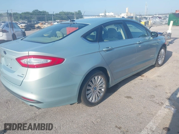 2013 Ford Fusion SE Hybrid with VIN 3FA6P0LU6DR111815, listed as a IAAI auction lot 42809852 with 150,721 mi miles and . Bid and sale history available at DreamBid. Image 4.