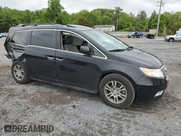 2013 Honda Odyssey EX-L with VIN 5FNRL5H69DB031498, listed as a Copart auction lot 55459745 with 129,773 mi miles and Salvage title. Bid and sale history available at DreamBid. Image 4.