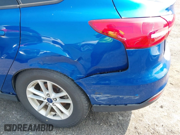 2018 Ford Focus SE z VIN 1FADP3FE1JL254632, wystawiony jako IAAI lot #42408683 z przebiegiem 74 696 mil mil oraz . Historia ofert i sprzedaży dostępna na DreamBid. Obrazek 6.