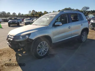 2014 Volkswagen Tiguan SE z VIN WVGAV3AX9EW611860, wystawiony jako Copart lot #74431754 z przebiegiem 116 022 mil mil oraz Szkoda całkowita • Salvage title. Historia ofert i sprzedaży dostępna na DreamBid. Obrazek 1.