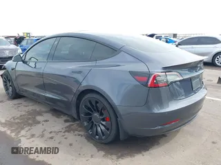 2022 Tesla Model 3 Performance with VIN 5YJ3E1EC3NF296891, listed as a IAAI auction lot 41808329 with 82,682 mi miles and . Bid and sale history available at DreamBid. Image 3.