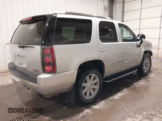 2014 GMC Yukon Denali with VIN 1GKS2EEF0ER134804, listed as a IAAI auction lot 41582709 with 142,192 mi miles. Bid and sale history available at carsss.com. Image 4.