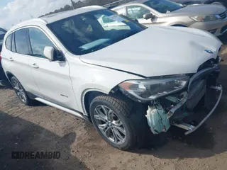 2017 BMW X1 xDrive28i with VIN WBXHT3Z30H4A64932, listed as a IAAI auction lot 41779359 with 72,612 mi miles. Bid and sale history available at carsss.com. Image 1.