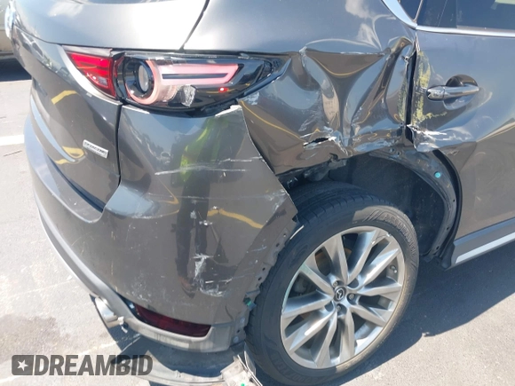2018 Mazda CX-5 Grand Touring with VIN JM3KFADM8J1310328, listed as a IAAI auction lot 42322780 with 106,378 mi miles and . Bid and sale history available at DreamBid. Image 6.