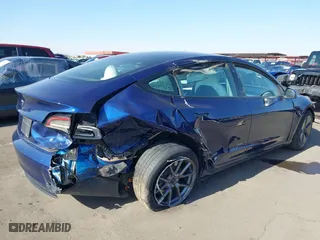 2023 Tesla Model 3 with VIN 5YJ3E1EA9PF697573, listed as a IAAI auction lot 41173833 with 6,966 mi miles. Bid and sale history available at carsss.com. Image 6.