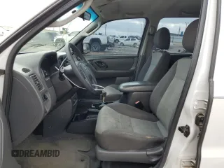 2004 Ford Escape XLS with VIN 1FMYU02144DA18217, listed as a Copart auction lot 43136895 with 135,424 mi miles and Salvage Title. Bid and sale history available at DreamBid. Image 7.