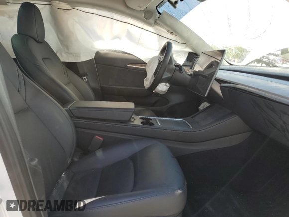 2023 Tesla Model 3 with VIN 5YJ3E1EA9PF558088, listed as a Copart auction lot 52228465 with 63,204 mi miles and Salvage title. Bid and sale history available at DreamBid. Image 7.