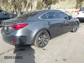 2016 Mazda Mazda6 i Grand Touring with VIN JM1GJ1W57G1441102, listed as a IAAI auction lot 41687057 with 144,876 mi miles. Bid and sale history available at carsss.com. Image 4.