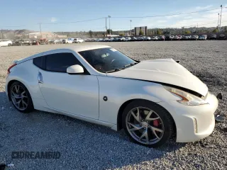 2014 Nissan 370Z Touring with VIN JN1AZ4EH7EM637101, listed as a Copart auction lot 41339705 with 105,841 mi miles and Salvage Title. Bid and sale history available at carsss.com. Image 4.