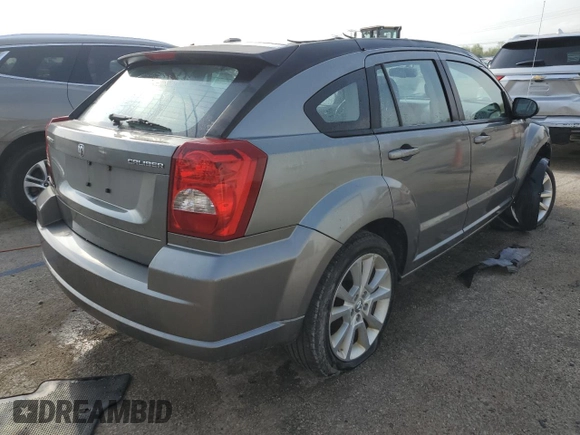 2011 Dodge Caliber Heat z VIN 1B3CB5HA4BD222393, wystawiony jako Copart lot #52901255 z przebiegiem 108 070 mil mil oraz Szkody całkowita. Historia ofert i sprzedaży dostępna na DreamBid. Obrazek 3.