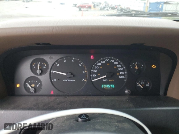 2002 Jeep Grand Cherokee z VIN 1J4GX38S72C152046, wystawiony jako Copart lot #57963095 z przebiegiem 204 576 mil mil oraz Szkoda całkowita • Salvage title. Historia ofert i sprzedaży dostępna na DreamBid. Obrazek 9.