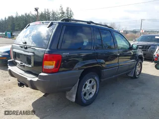 1999 Jeep Grand Cherokee Laredo with VIN 1J4GW58S6XC524451, listed as a IAAI auction lot 41741007 with 162,441 mi miles. Bid and sale history available at carsss.com. Image 4.