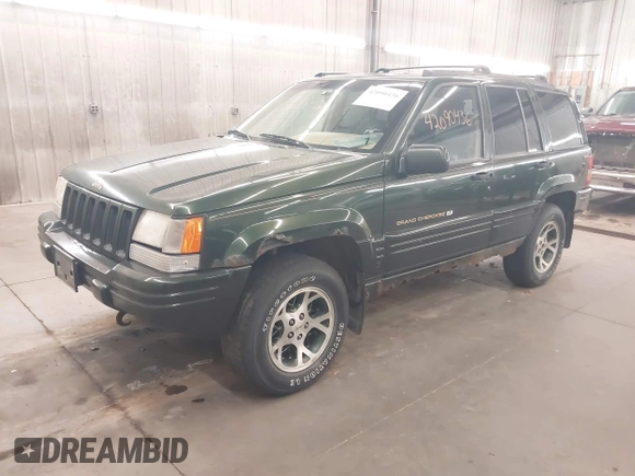 1997 Jeep Grand Cherokee Limited with VIN 1J4GZ78Y0VC684023, listed as a IAAI auction lot 42090436 with 310,831 mi miles. Bid and sale history available at carsss.com. Image 2.