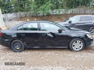 2017 Volkswagen Jetta S z VIN 3VW2B7AJ3HM303198, wystawiony jako IAAI lot #42651056 z przebiegiem 126 253 mil mil oraz . Historia ofert i sprzedaży dostępna na DreamBid. Obrazek 14.