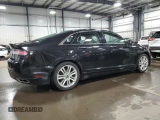 2014 Lincoln MKZ z VIN 3LN6L2JKXER819971, wystawiony jako Copart lot #49979115 z przebiegiem 132 602 mil mil oraz Szkoda całkowita • Salvage title. Historia ofert i sprzedaży dostępna na DreamBid. Obrazek 3.