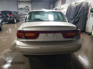 2000 Saturn SL with VIN 1G8ZK5278YZ269342, listed as a Copart auction lot 82573694 with 53,641 mi miles and Salvage title. Bid and sale history available at DreamBid. Image 6.
