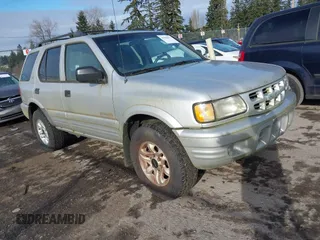 2002 Isuzu Rodeo with VIN 4S2DM58W924321403, listed as a IAAI auction lot 41503572 with 235,072 mi miles. Bid and sale history available at carsss.com. Image 1.