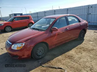 2009 Kia Spectra EX with VIN KNAFE221395656476, listed as a Copart auction lot 77700844 with 90,079 mi miles and Salvage Title. Bid and sale history available at carsss.com. Image 1.