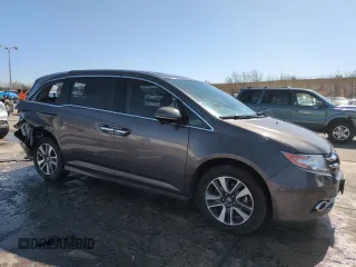 2014 Honda Odyssey Touring with VIN 5FNRL5H95EB052523, listed as a Copart auction lot 52214055 with 131,350 mi miles and Salvage Title. Bid and sale history available at DreamBid. Image 4.
