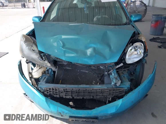 2013 Honda Fit Sport z VIN JHMGE8H54DC026019, wystawiony jako IAAI lot #42125500 z przebiegiem 139 285 mil mil oraz . Historia ofert i sprzedaży dostępna na DreamBid. Obrazek 12.