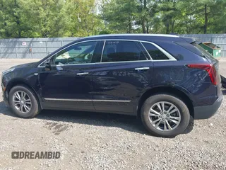 2021 Cadillac XT5 AWD Premium Luxury z VIN 1GYKNDRS8MZ217572, wystawiony jako IAAI lot #42190571 z przebiegiem 25 100 mil mil oraz . Historia ofert i sprzedaży dostępna na DreamBid. Obrazek 14.