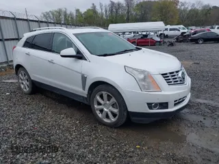 2014 Cadillac SRX Premium Collection z VIN 3GYFNDE3XES574251, wystawiony jako IAAI lot #41863442 z przebiegiem 226 059 mil mil oraz . Historia ofert i sprzedaży dostępna na DreamBid. Obrazek 1.