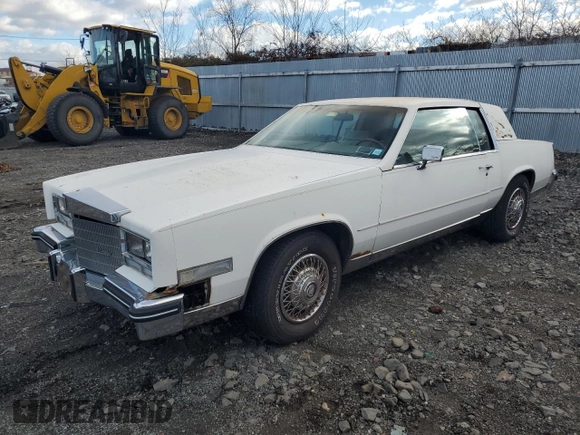 1985 Cadillac Eldorado z VIN 1G6EL578XFE673656, wystawiony jako Copart lot #86803334 z przebiegiem 94 396 mil mil oraz Tytuł czysty. Historia ofert i sprzedaży dostępna na DreamBid. Obrazek 1.