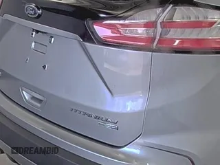 2020 Ford Edge Titanium z VIN 2FMPK4K91LBA91290, wystawiony jako IAAI lot #42494043 z przebiegiem 71 254 mil mil oraz . Historia ofert i sprzedaży dostępna na DreamBid. Obrazek 12.