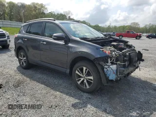 2018 Toyota RAV4 XLE with VIN JTMRFREV2JJ215776, listed as a Copart auction lot 51745205 with 52,009 mi miles and Salvage Title. Bid and sale history available at DreamBid. Image 4.