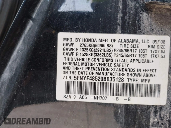 2009 Honda Pilot EX-L with VIN 5FNYF48529B035128, listed as a IAAI auction lot 42006450 with 214,069 mi miles. Bid and sale history available at carsss.com. Image 9.