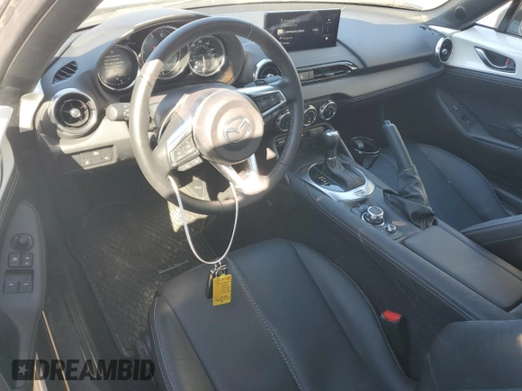 2024 Mazda MX-5 Miata Grand Touring z VIN JM1NDAM76R0602972, wystawiony jako Copart lot #77665904 z przebiegiem 4 965 mil mil oraz Szkoda całkowita • Salvage title. Historia ofert i sprzedaży dostępna na DreamBid. Obrazek 8.