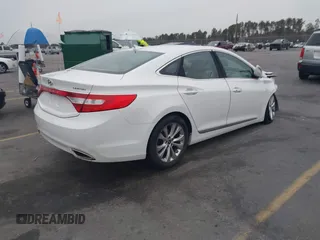 2014 Hyundai Azera Limited z VIN KMHFH4JG7EA365603, wystawiony jako IAAI lot #41297919 z przebiegiem 83 690 mil mil oraz . Historia ofert i sprzedaży dostępna na DreamBid. Obrazek 4.