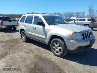 2010 Jeep Grand Cherokee Laredo with VIN 1J4PR4GK2AC125918, listed as a IAAI auction lot 41899078 with 236,229 mi miles. Bid and sale history available at carsss.com. Image 1.