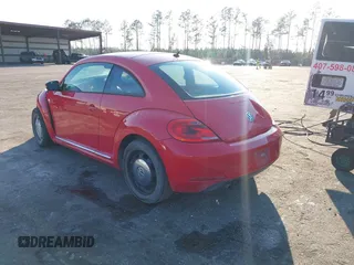 2013 Volkswagen Beetle Fender Edition z VIN 3VWJP7AT8DM674981, wystawiony jako IAAI lot #41685176 z przebiegiem 65 283 mil mil oraz . Historia ofert i sprzedaży dostępna na DreamBid. Obrazek 3.