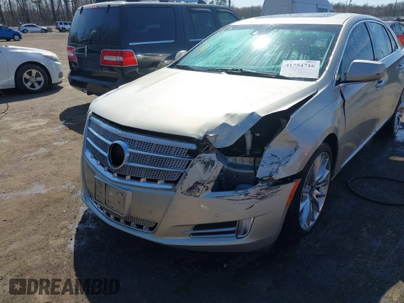 2013 Cadillac XTS Platinum z VIN 2G61U5S37D9209926, wystawiony jako IAAI lot #41754716 z przebiegiem 126 239 mil mil oraz . Historia ofert i sprzedaży dostępna na DreamBid. Obrazek 6.