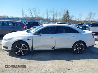 2014 Ford Taurus SEL z VIN 1FAHP2E81EG104137, wystawiony jako IAAI lot #42054432 z przebiegiem 146 046 mil mil oraz . Historia ofert i sprzedaży dostępna na DreamBid. Obrazek 14.
