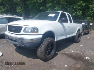 2001 Ford F-150 XL with VIN 1FTRX18L71NB11026, listed as a IAAI auction lot 42590063 with 218,156 mi miles and . Bid and sale history available at DreamBid. Image 2.