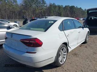 2019 Volkswagen Passat 2.0T Wolfsburg Edition with VIN 1VWLA7A32KC000818, listed as a IAAI auction lot 41711518 with 87,873 mi miles. Bid and sale history available at carsss.com. Image 4.