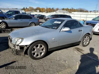 2000 Mercedes-Benz SLK-Class Kompressor with VIN WDBKK47F2YF150980, listed as a Copart auction lot 77537264 with 82,206 mi miles and Salvage Title. Bid and sale history available at carsss.com. Image 1.