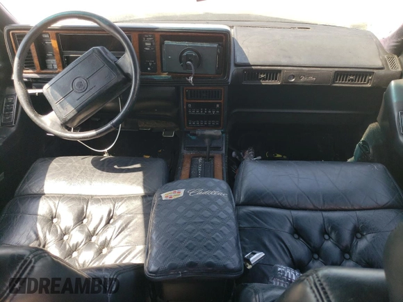1991 Cadillac Seville z VIN 1G6KS53B9MU824142, wystawiony jako Copart lot #74276264 z przebiegiem 103 517 mil mil oraz Szkody całkowita. Historia ofert i sprzedaży dostępna na DreamBid. Obrazek 8.