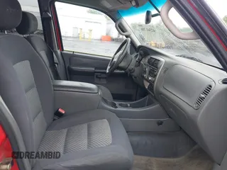 2005 Ford Explorer Sport Trac XLS z VIN 1FMZU77K95UB44976, wystawiony jako IAAI lot #42341706 z przebiegiem 107 539 mil mil oraz . Historia ofert i sprzedaży dostępna na DreamBid. Obrazek 5.
