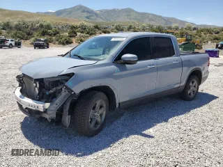 2022 Honda Ridgeline RTL-E with VIN 5FPYK3F79NB024459, listed as a Copart auction lot 59165445 with 21,429 mi miles and Salvage title. Bid and sale history available at DreamBid. Image 1.